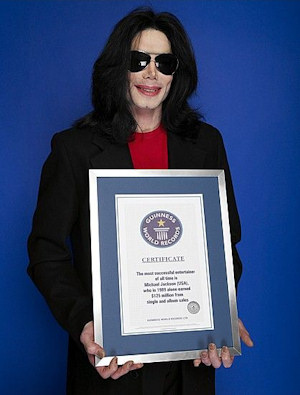 Michael-holding-Guinness-certificate.jpg